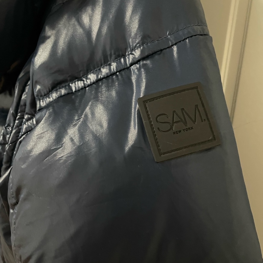 Brand new SAM. jacket size medium color navy. Real fur.
